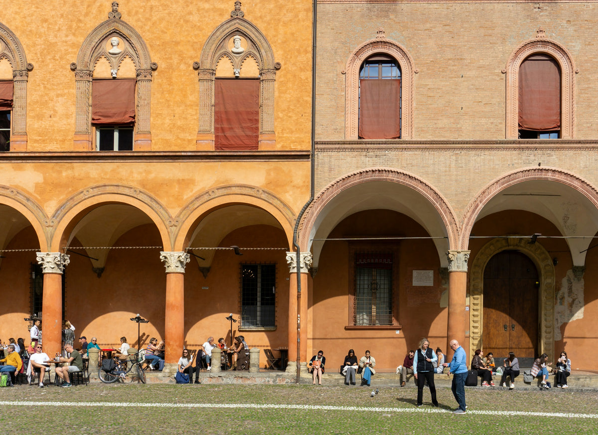 People beneath Bologna's porticoes