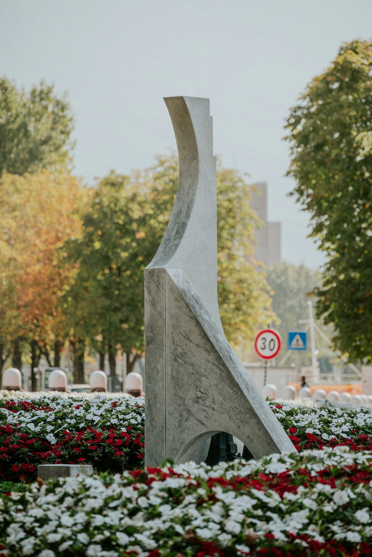 A sculpture among the flower beds
