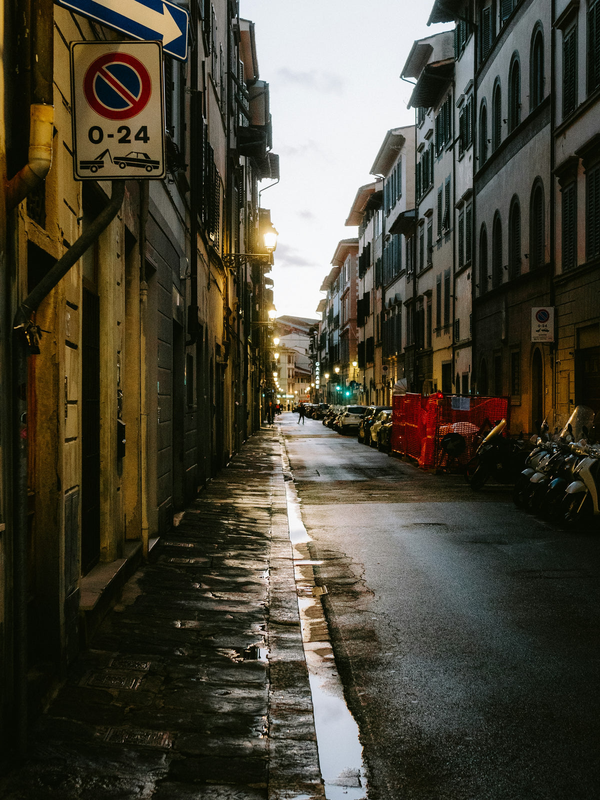 A quiet street in the centre at dusk, glistening after rain