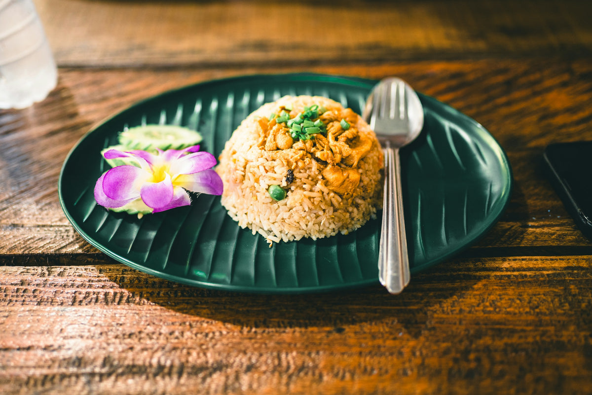 Thai fried rice garnished with an orchid, Phuket