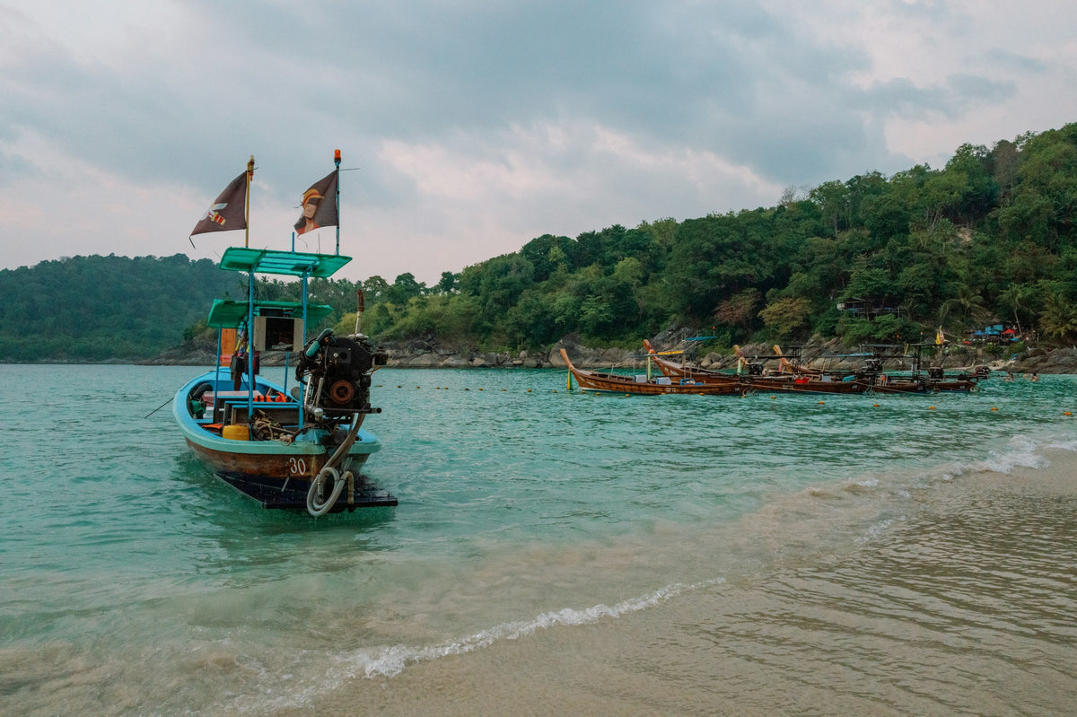 Longtail boat in the shallows at Freedom Beach