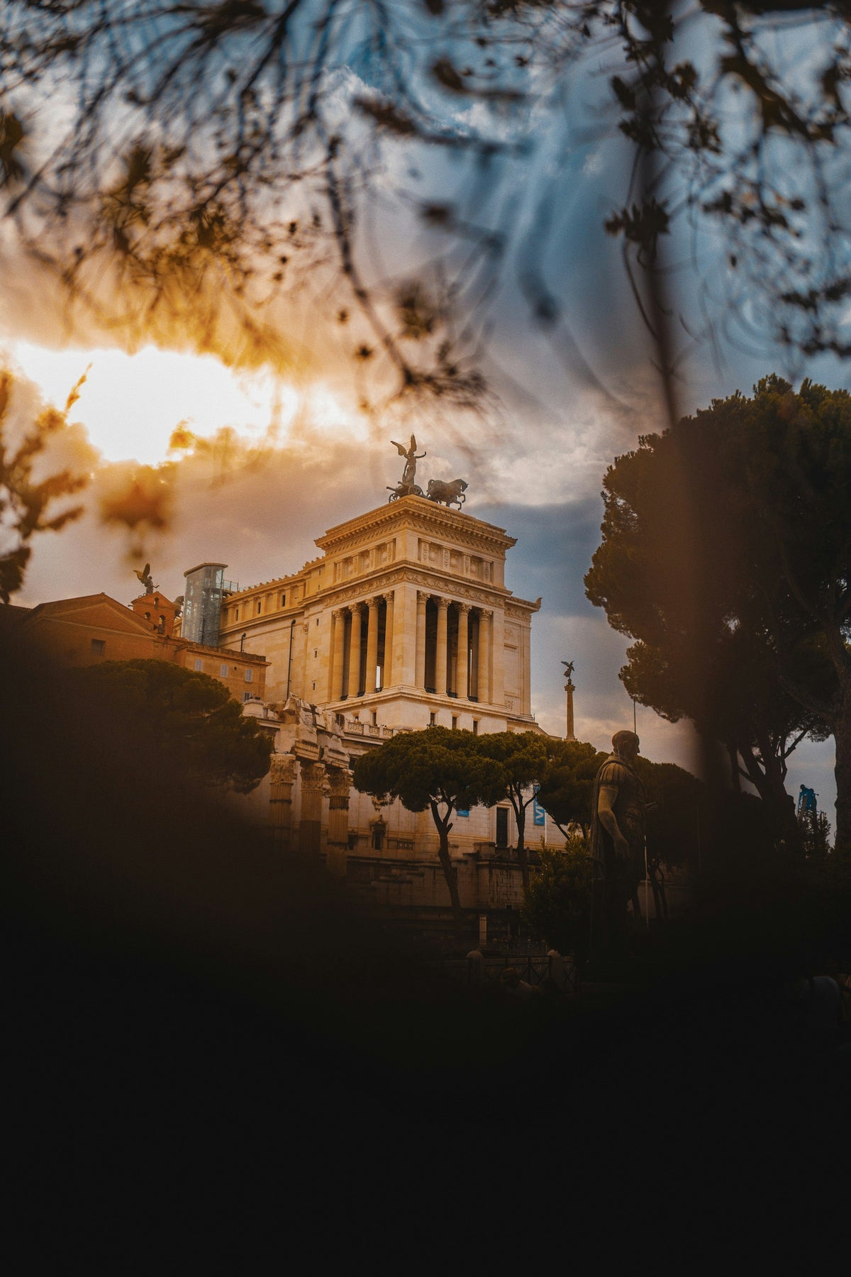 The Altare della Patria framed by trees at sunset