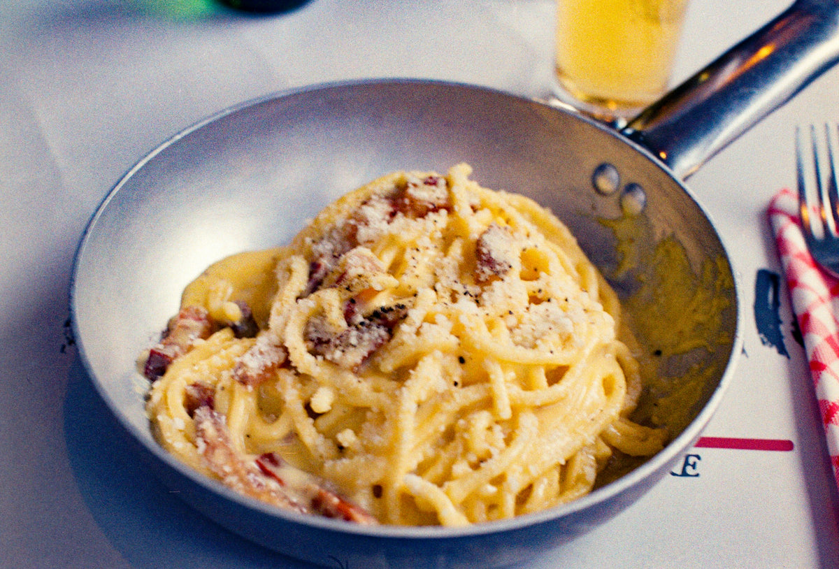 Spaghetti alla carbonara served in the pan at a Trastevere osteria