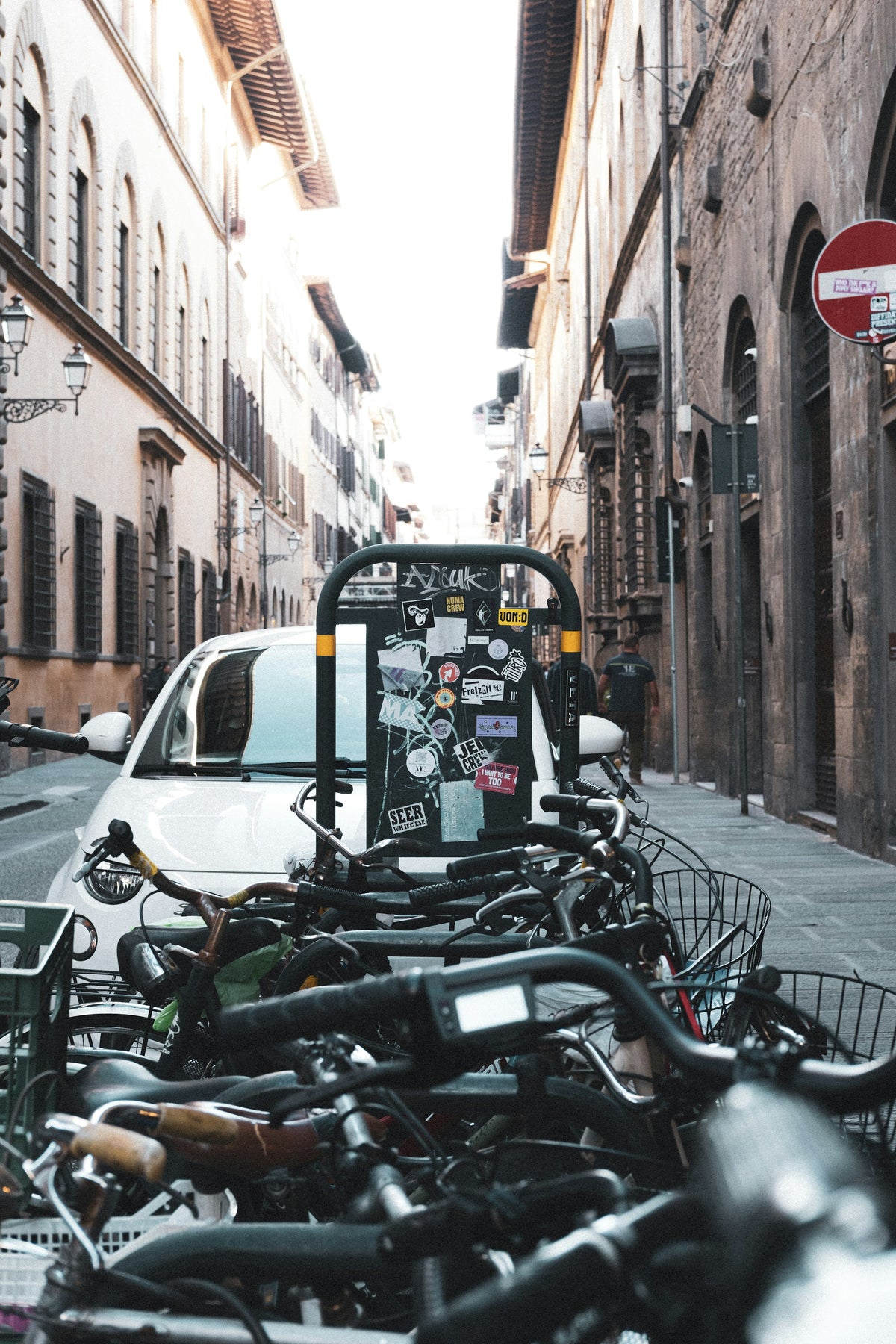 Bicycles parked along a narrow street in the centre