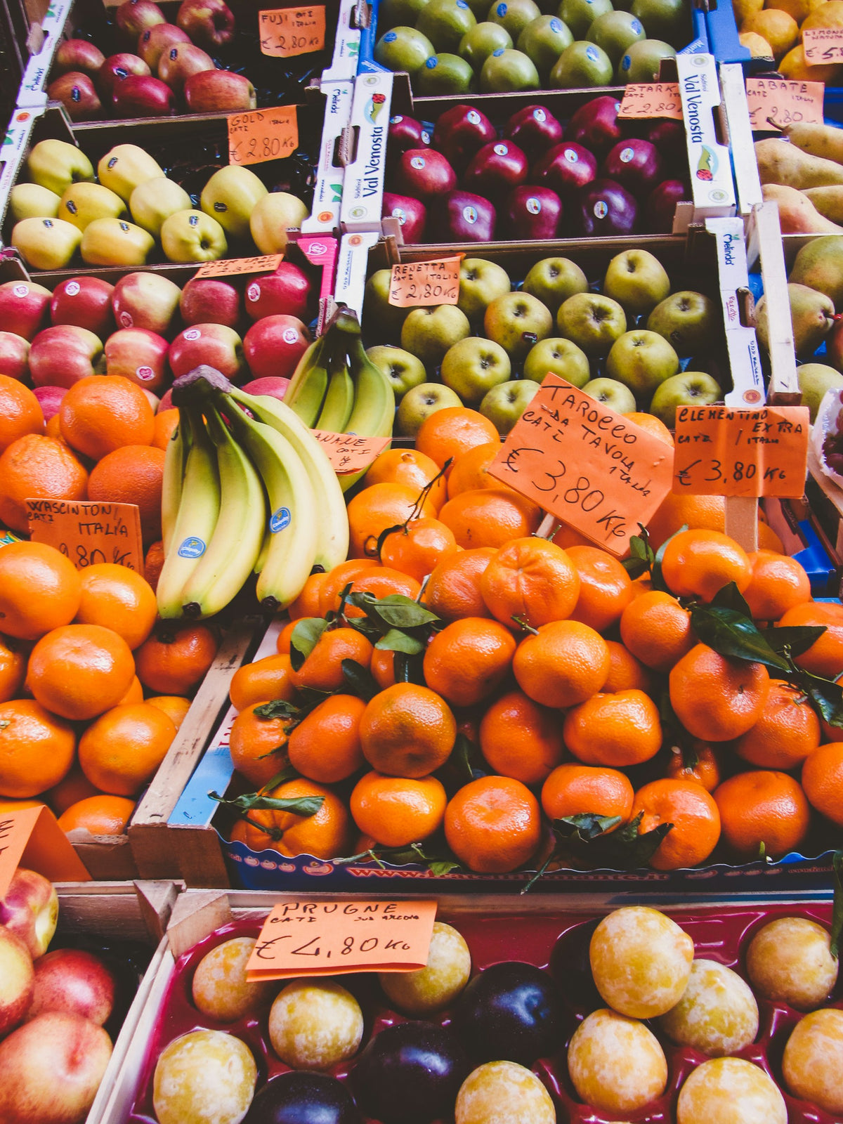 Fresh produce in crates at a Bologna street market