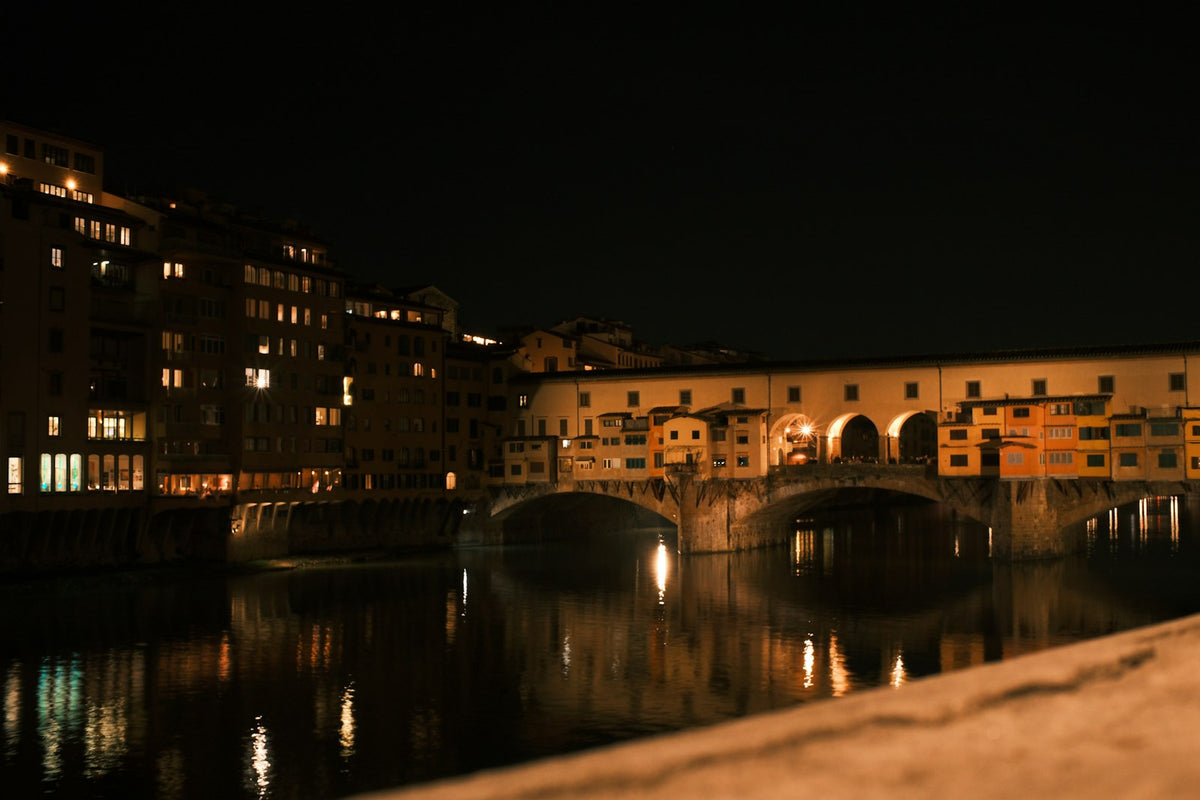 Ponte Vecchio lit up at night over the Arno