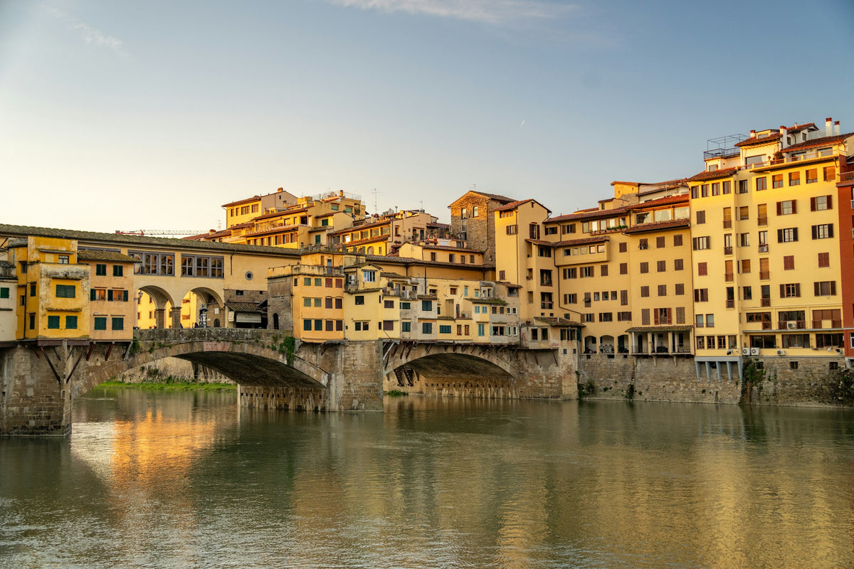 Ponte Vecchio and its overhanging shops at sunset