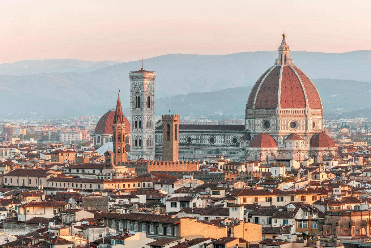 Florence at sunrise, Brunelleschi's dome and Giotto's bell tower above the rooftops