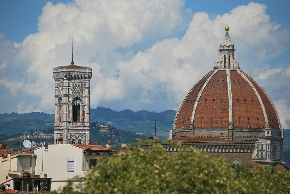 The Duomo and Giotto's bell tower under a cloudy sky