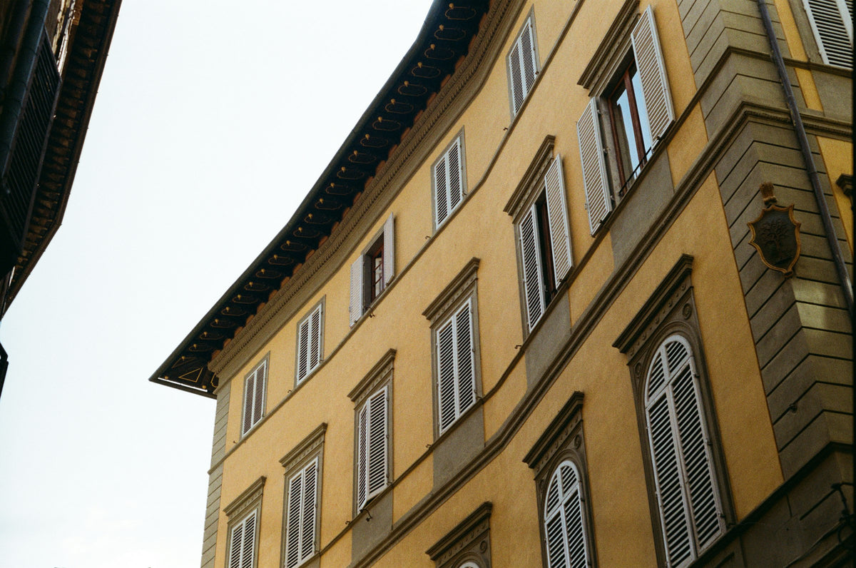 Shuttered windows on a golden Florentine palazzo