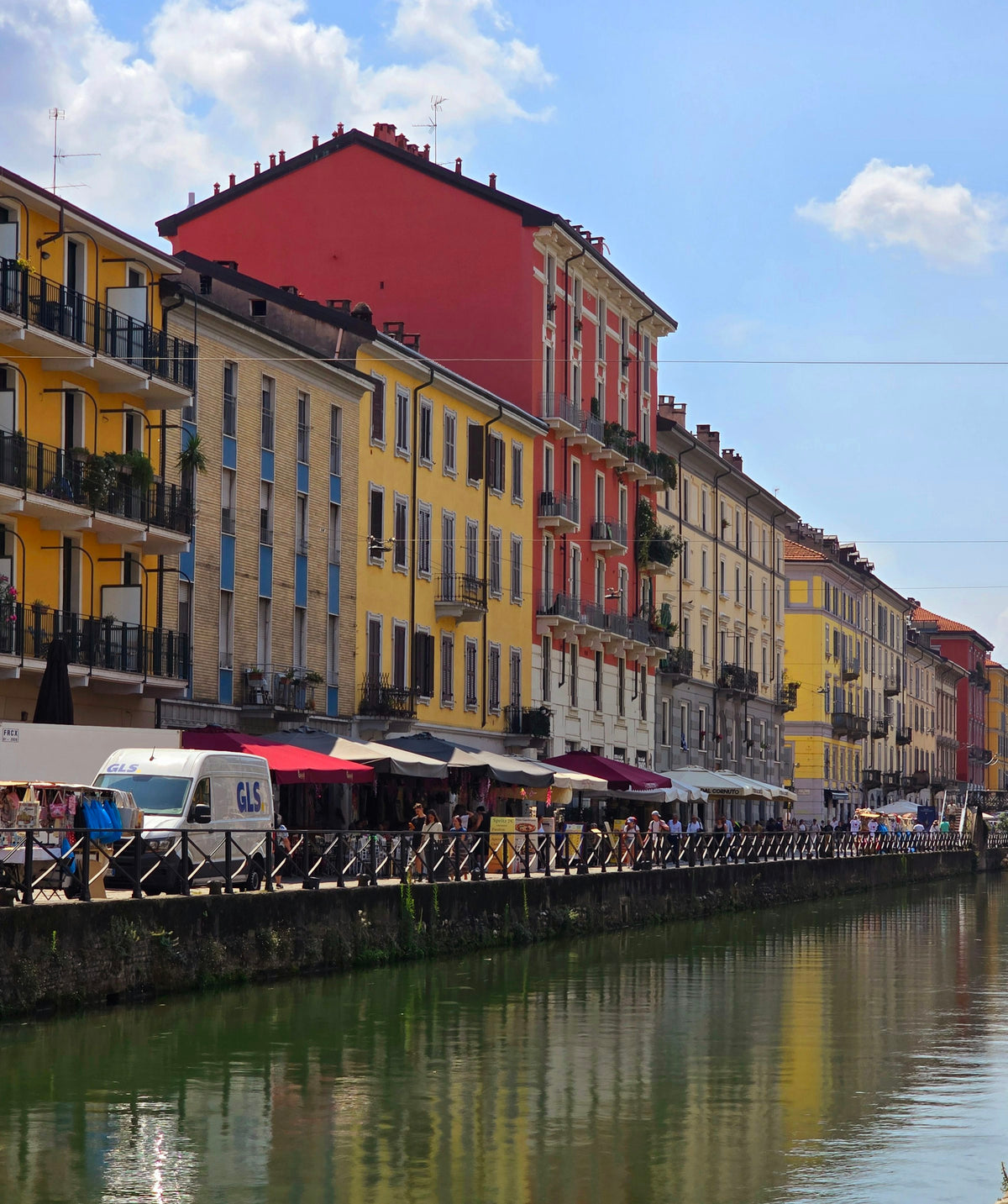 Colourful buildings along a canal in the Navigli district of Milan