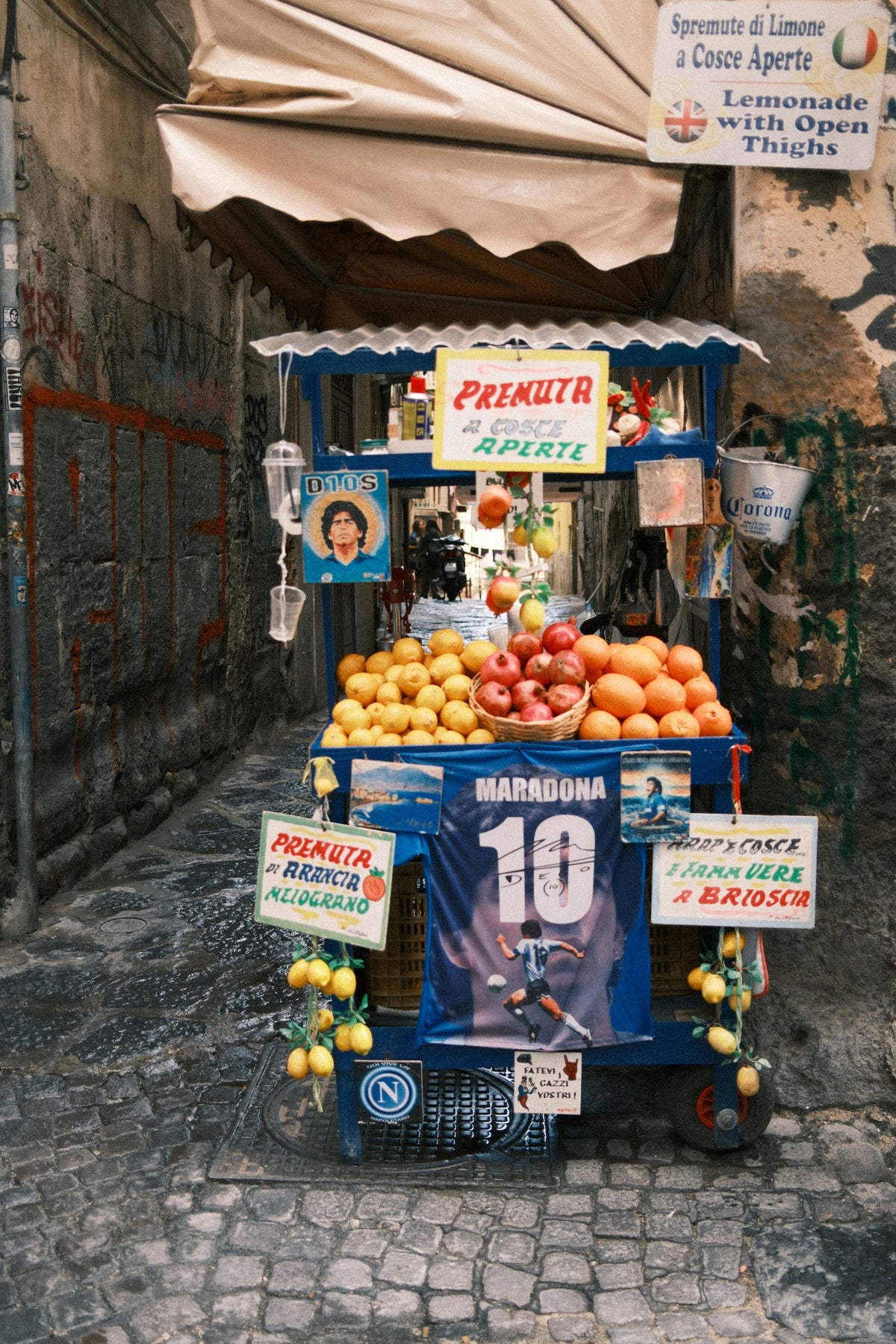 A street lemonade cart with Maradona memorabilia