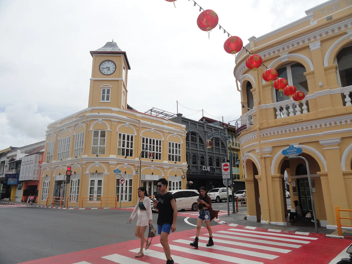 Street life in front of a yellow heritage building in the old town