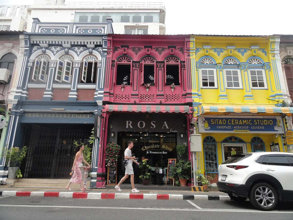 Pastel shophouses lining a street in Phuket Old Town