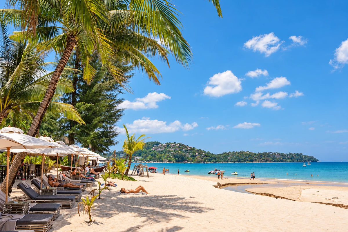 Palm trees, pale sand and turquoise water at Bang Tao Beach
