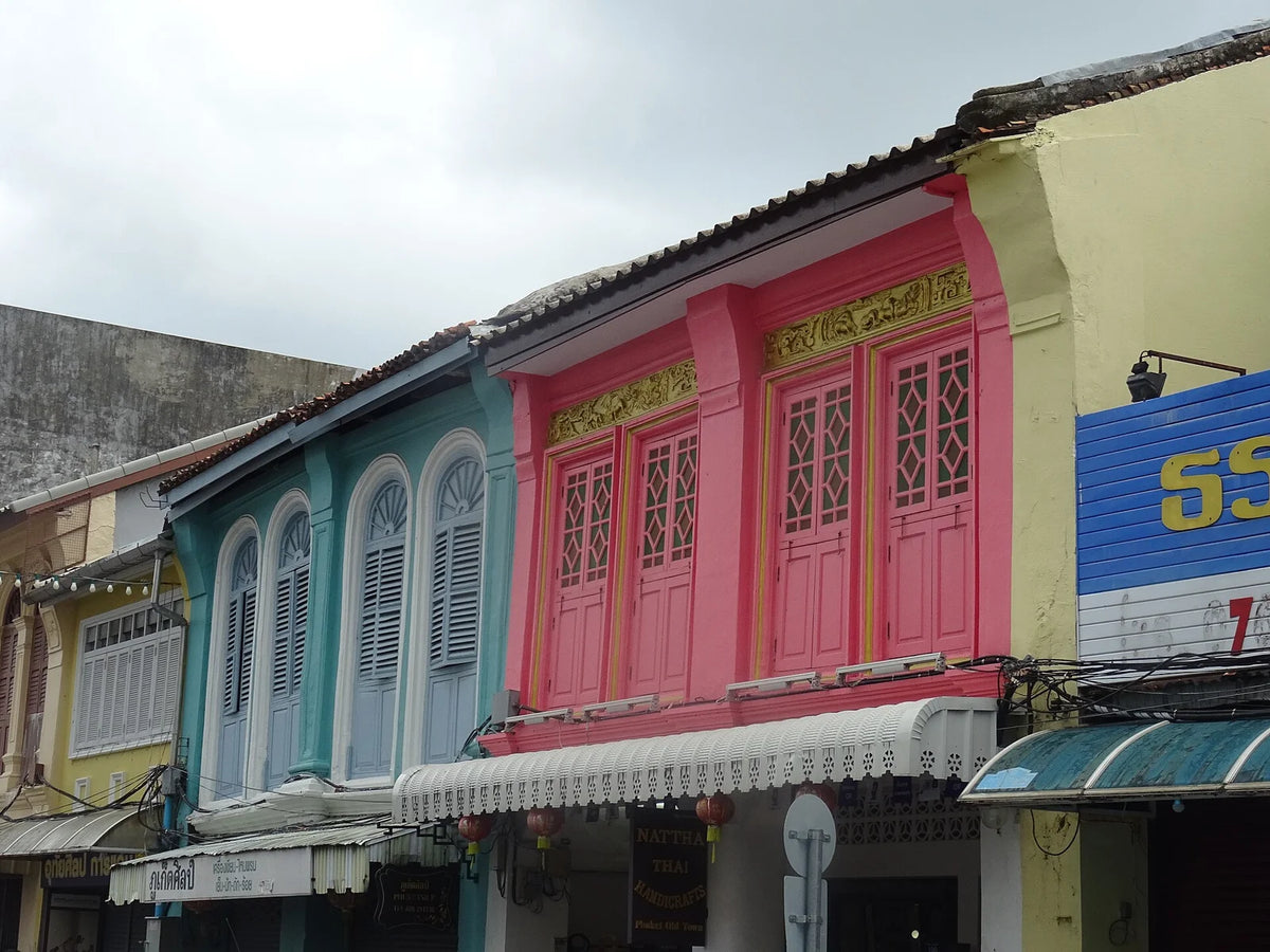 Colourful shophouses and an everyday street scene in Phuket Old Town