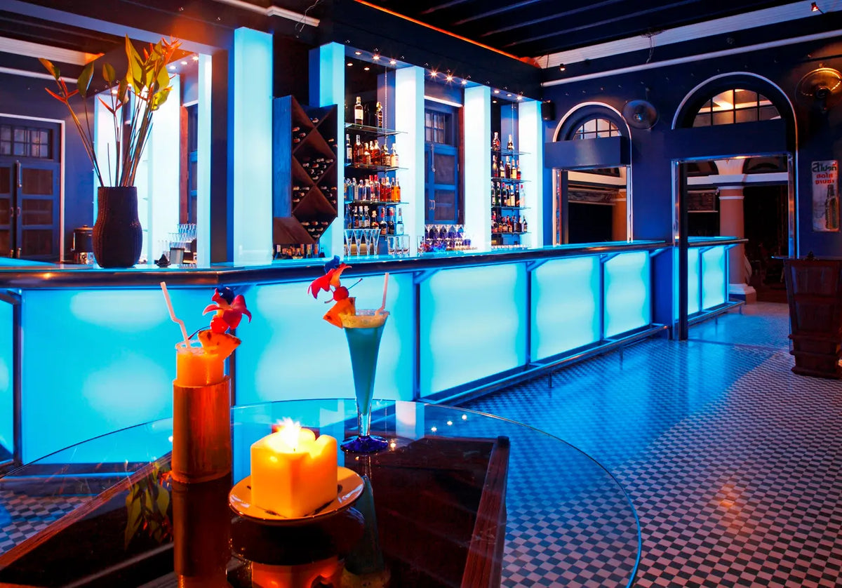 Illuminated blue bar with cocktails at Blue Elephant Phuket