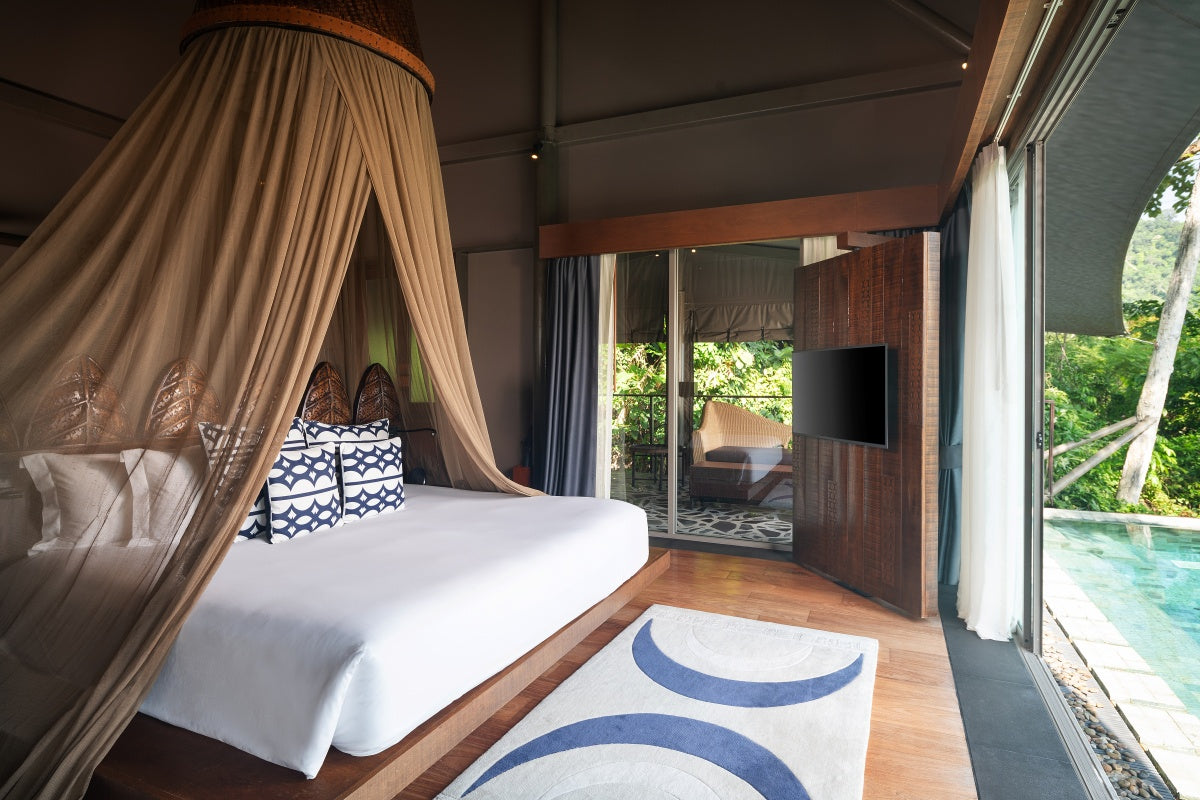 Tent Pool Villa bedroom with canopy bed at Keemala