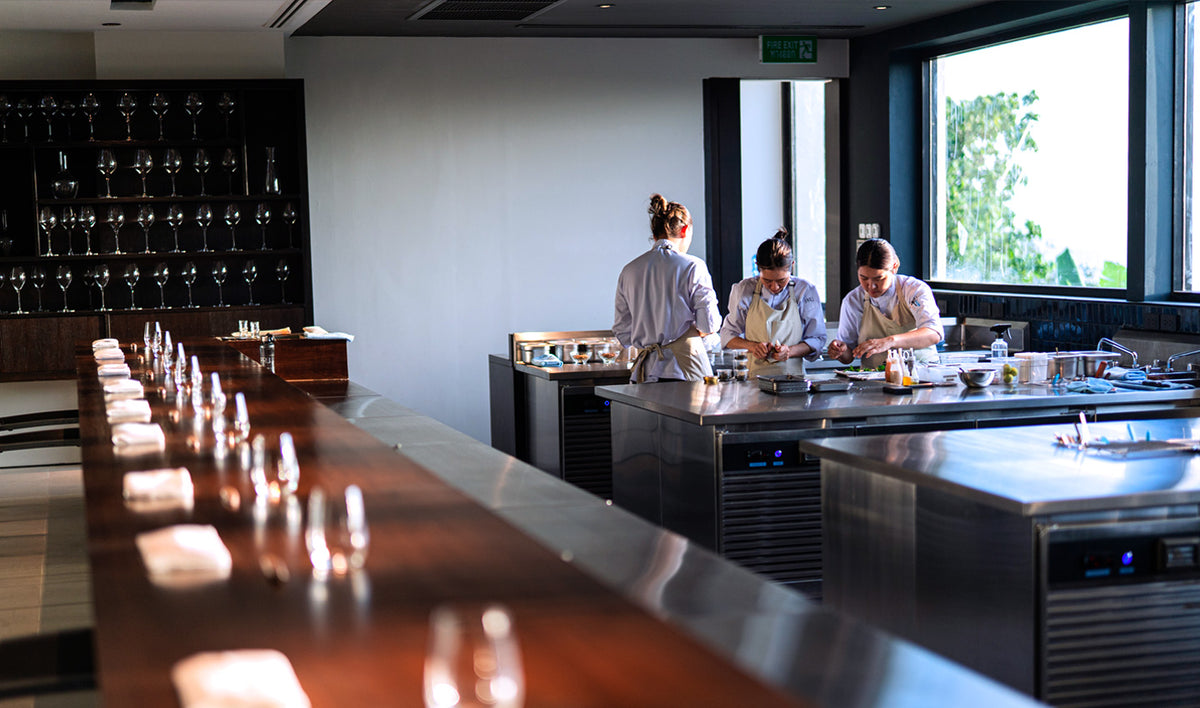 Chef's counter facing the open kitchen at PRU