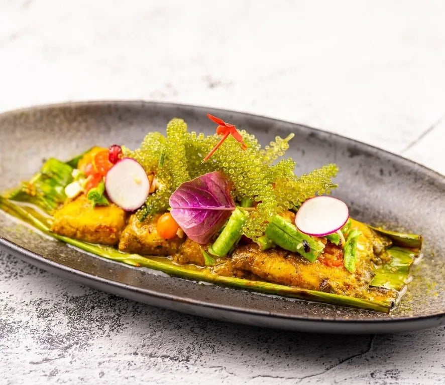 Marinated sea bass with sea grapes and radish at SUAY Cherngtalay