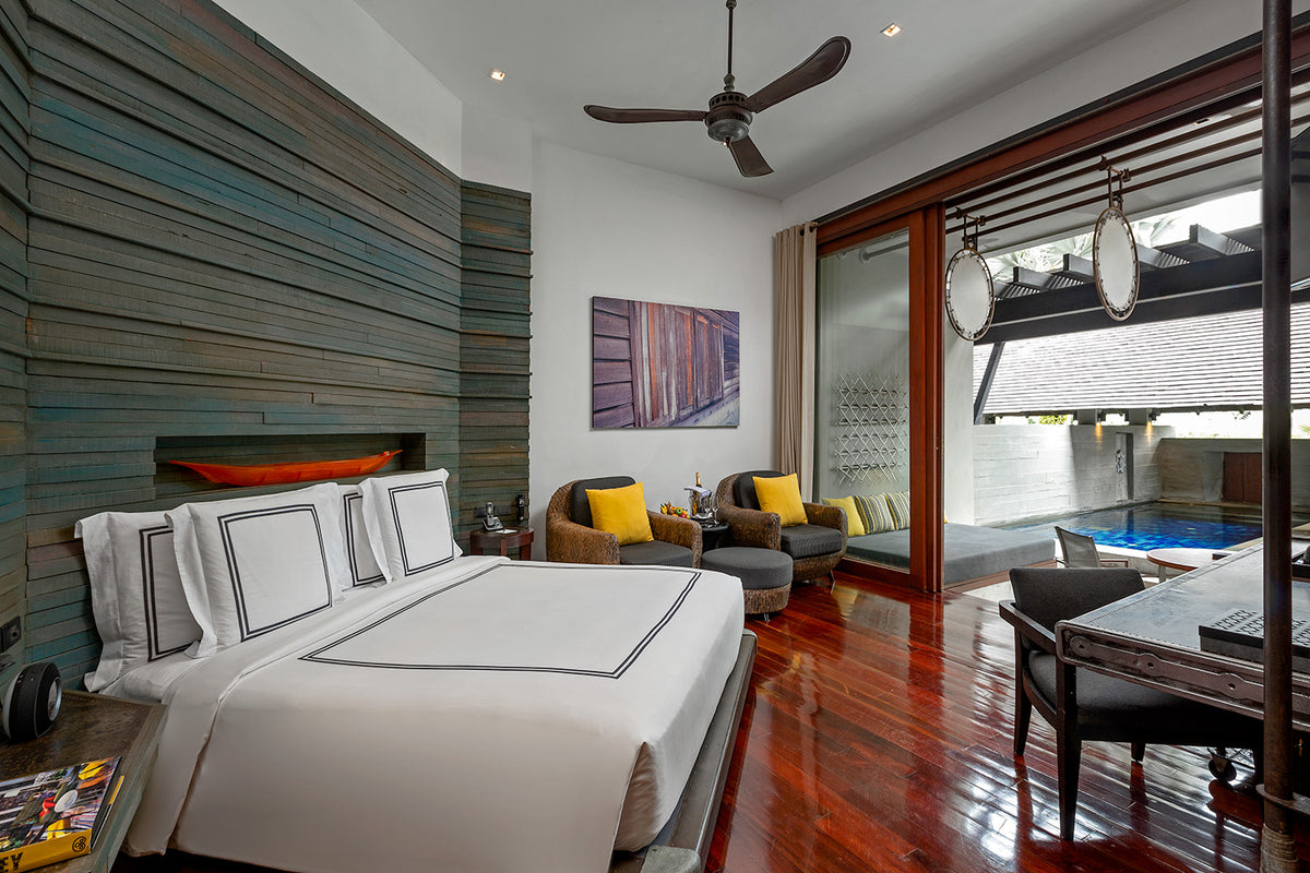 Private Pool Suite bedroom with timber walls at The Slate