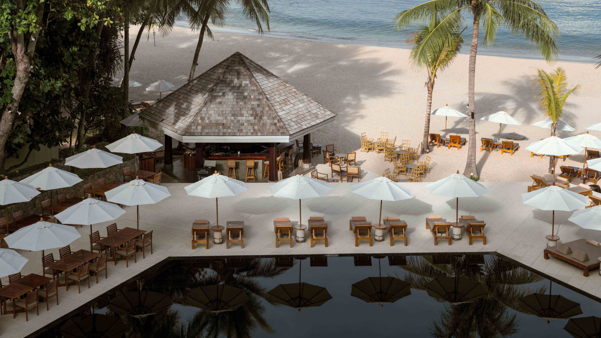 Beachfront restaurant and pool at The Surin Phuket
