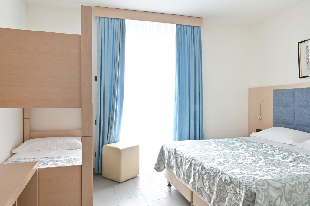 A quadruple room at Hotel Marco's