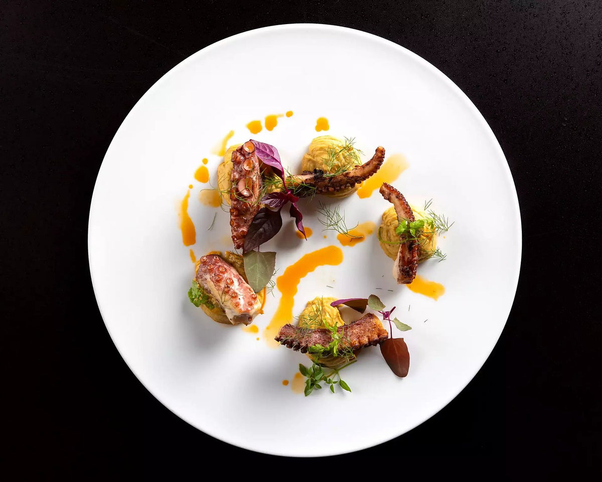 A colourful plated course with vegetable purée at Antico Arco