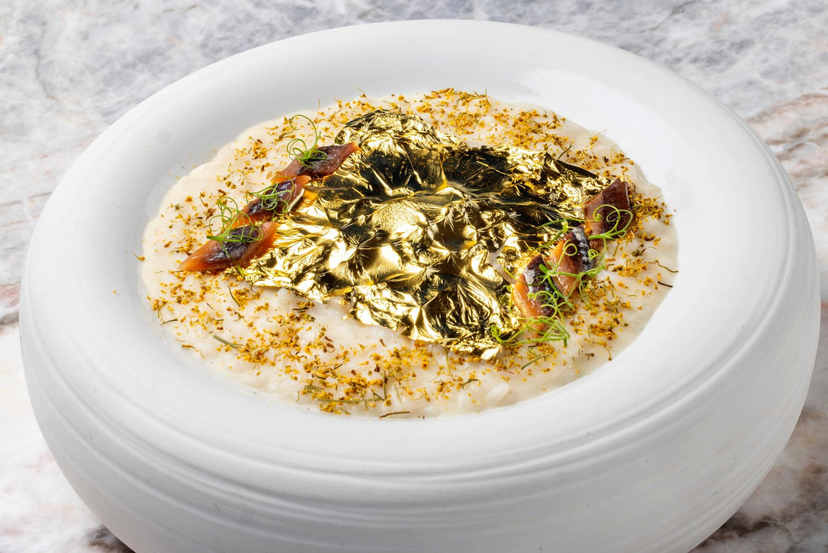 A risotto finished with gold leaf at Aroma