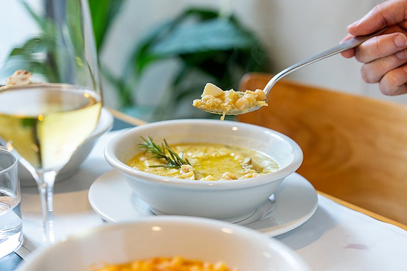 A bowl of soup finished with rosemary at Da Cesare al Casaletto