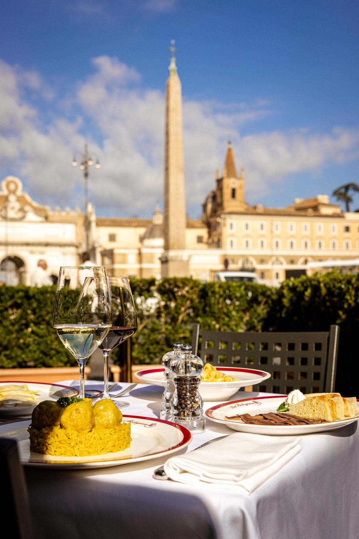Lunch on the terrace of Dal Bolognese, with the obelisk of Piazza del Popolo behind