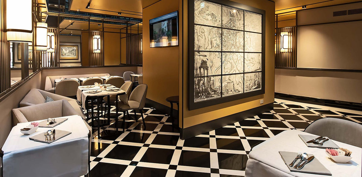 The lounge with its black-and-white floor at Hotel Lunetta