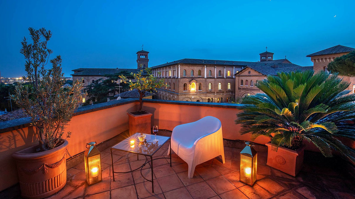 A terrace at dusk at Hotel San Anselmo