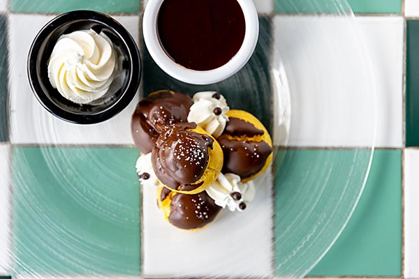 A chocolate dessert with whipped cream at Necci dal 1924