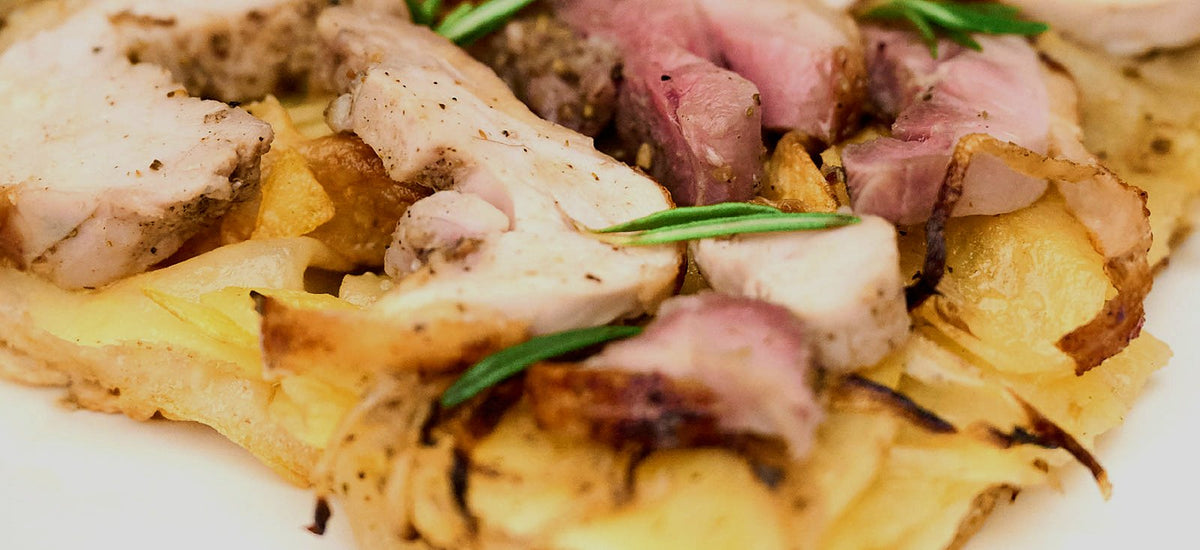 Pizza topped with roast pork and rosemary by Bonci