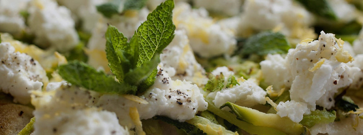 Pizza with fresh cheese and mint by Bonci