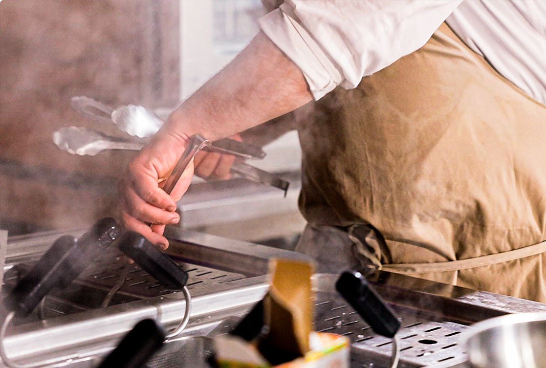 At the stove at Roscioli Salumeria con Cucina