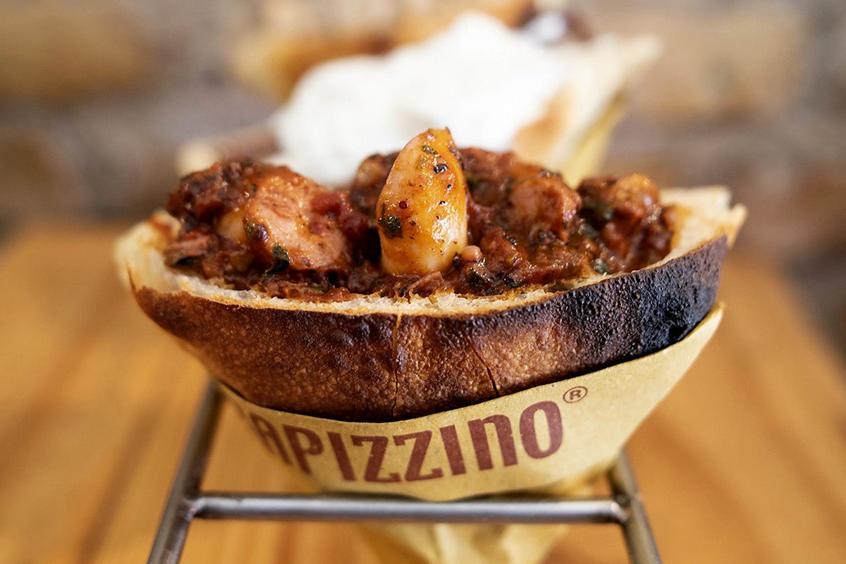 A trapizzino filled with stew at Trapizzino Testaccio