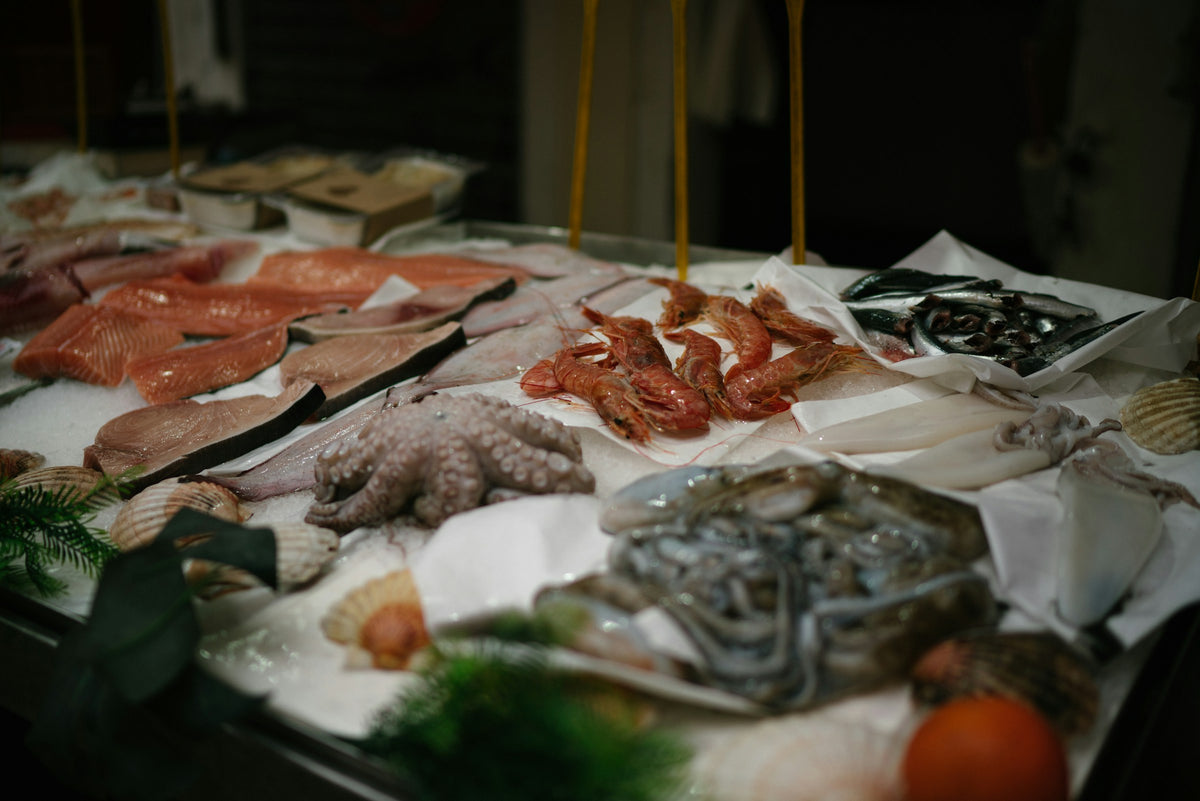 Octopus, prawns, salmon and fish on ice at a Venice market stall
