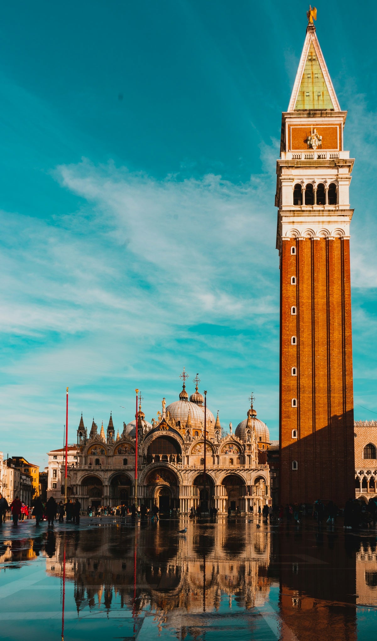 Acqua alta on Piazza San Marco, mirroring the Basilica and Campanile