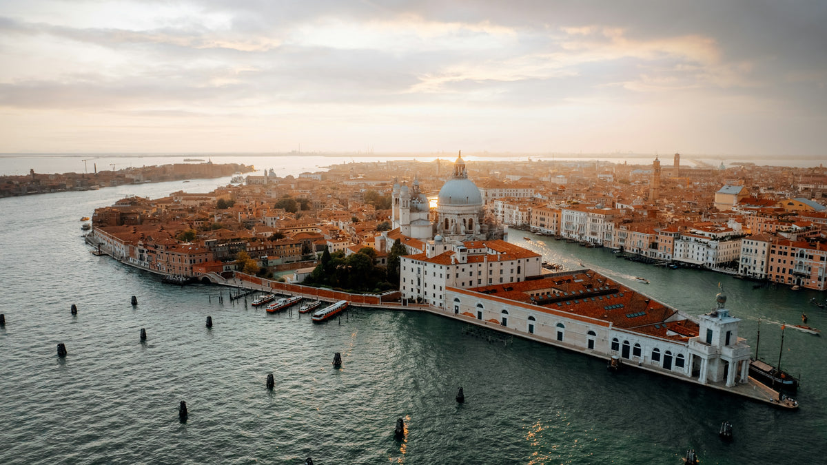 Punta della Dogana and the Salute dome from above at sunrise