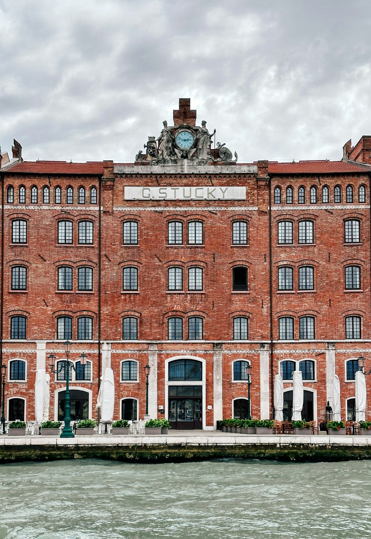 The red-brick Molino Stucky building on Giudecca seen across the water