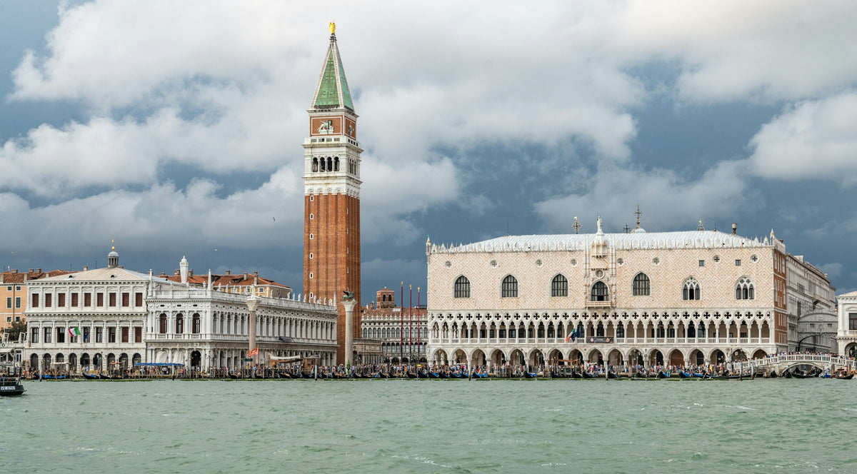 St Mark's Campanile and the Doge's Palace seen from the water under clouds