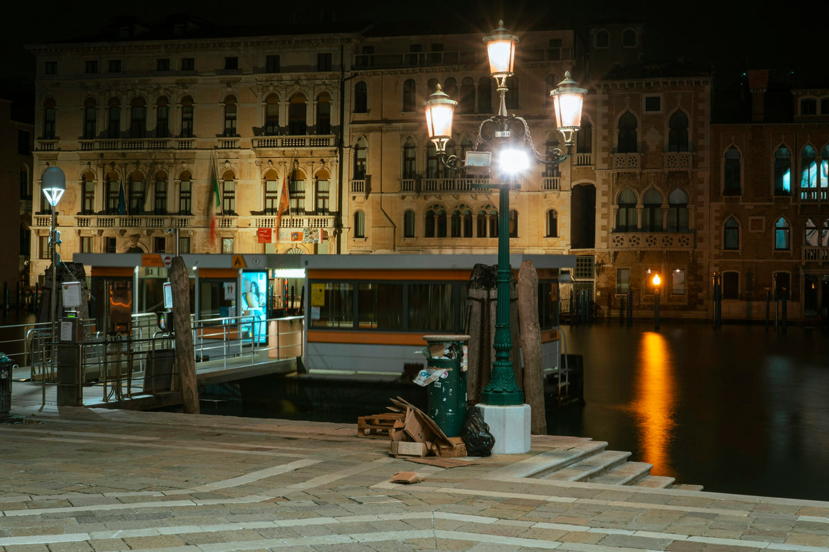 A vaporetto stop on the Grand Canal lit up at night