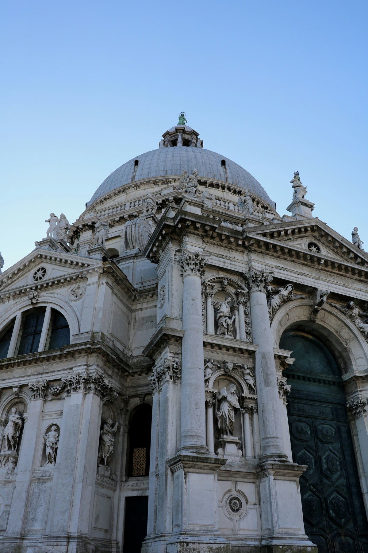 The dome and Baroque facade of Santa Maria della Salute seen from below