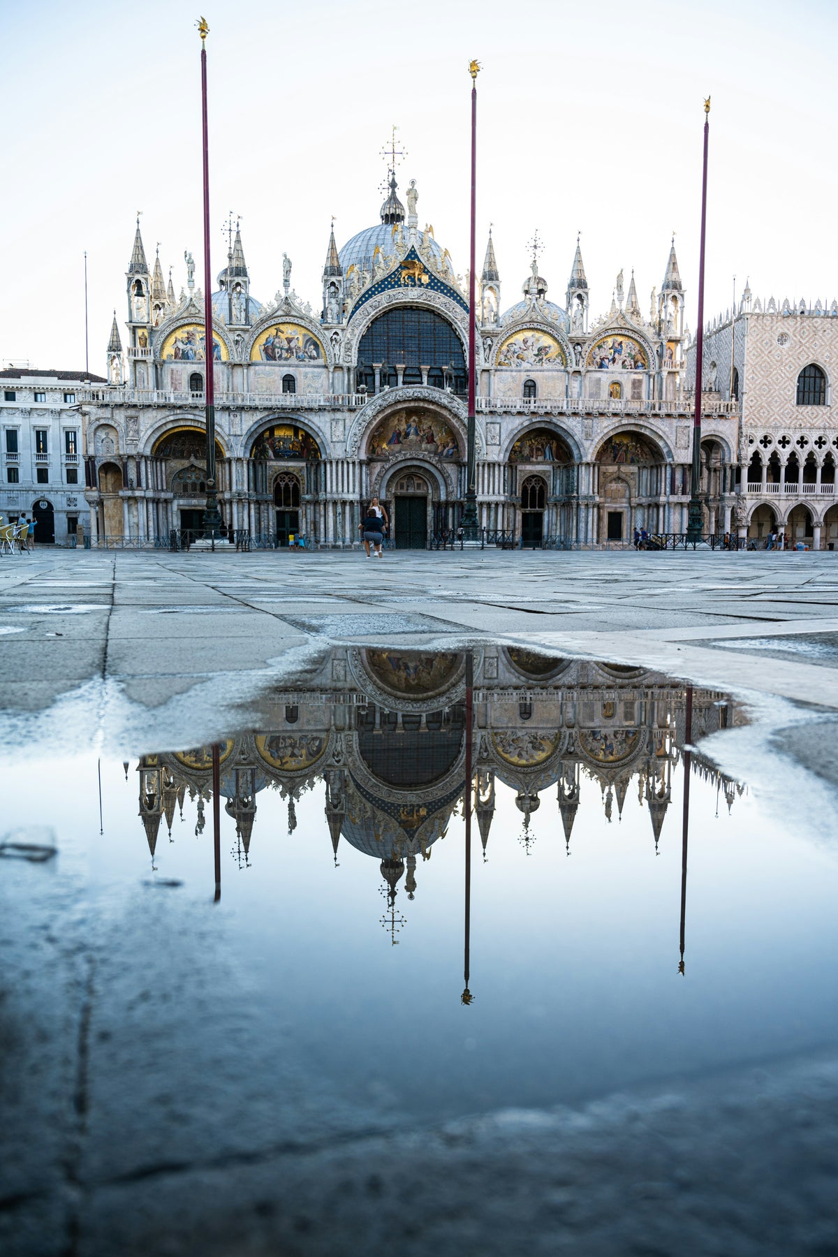 St Mark's Basilica reflected in a rain puddle on Piazza San Marco