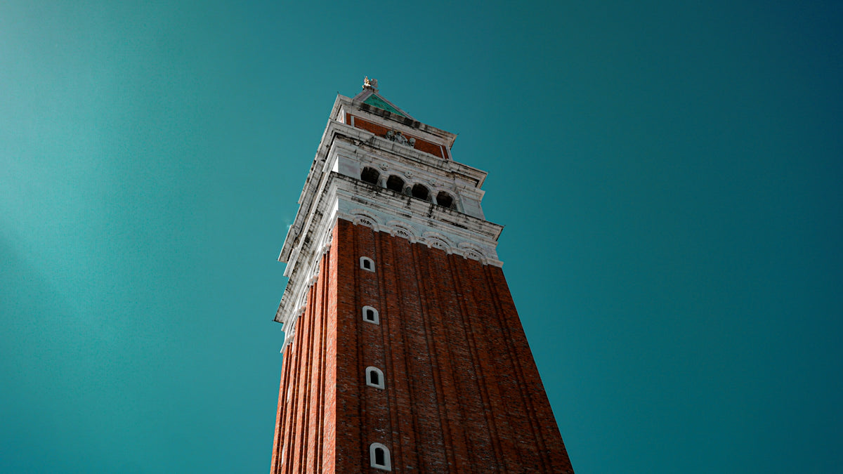 St Mark's Campanile seen from below against a deep blue sky