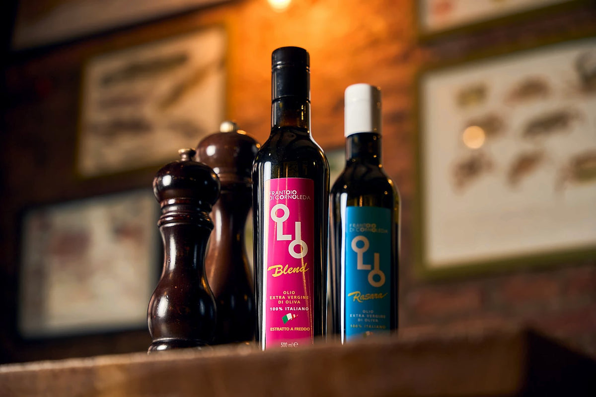 Olive oil bottles and pepper mills on a table in the dining room