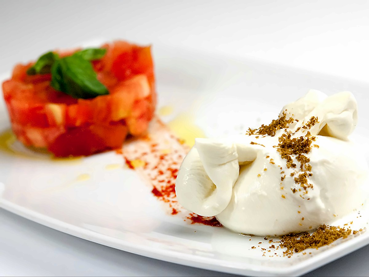 Burrata with diced tomato and basil at Osteria Bancogiro
